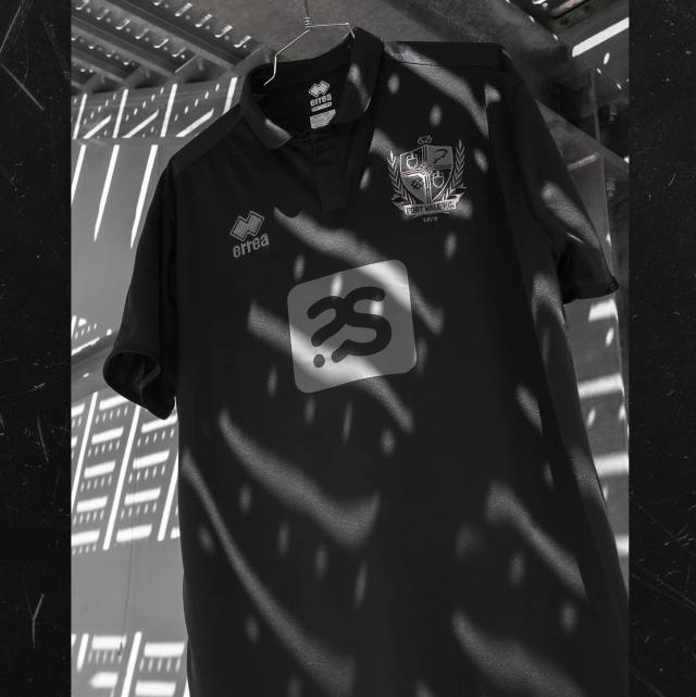 A black Port Vale F.C. away shirt hanging under patterned shadows.