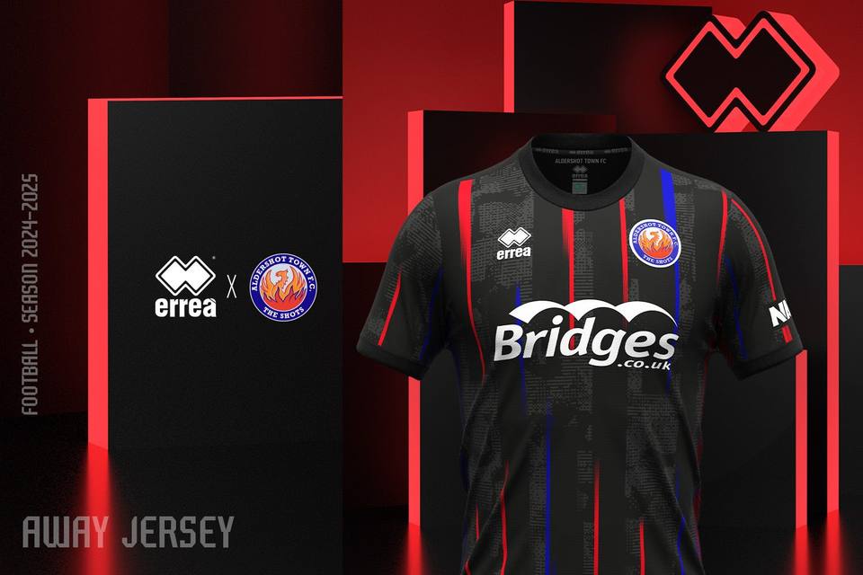 Aldershot Town FC 2024/25 away shirt by Erreà, featuring a black design with red and blue vertical stripes.