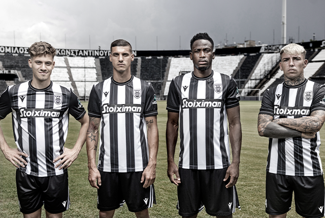 PAOK FC players presenting the new home shirt with classic black and white vertical stripes.