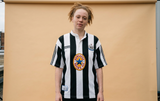 AI recreation of the Newcastle United home 1995-97 shirt, generated by Kitlist from its documented design record.