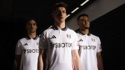Fulham players model the 2024/25 home kit in a campaign photo shoot.
