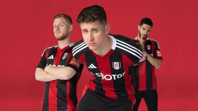 Fulham FC players presenting the 2024/25 away shirt against a red background.
