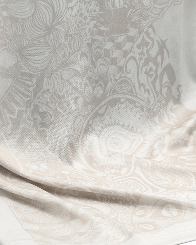 A close-up view of the patterned white fabric of the SSC Napoli 2025/26 away shirt.