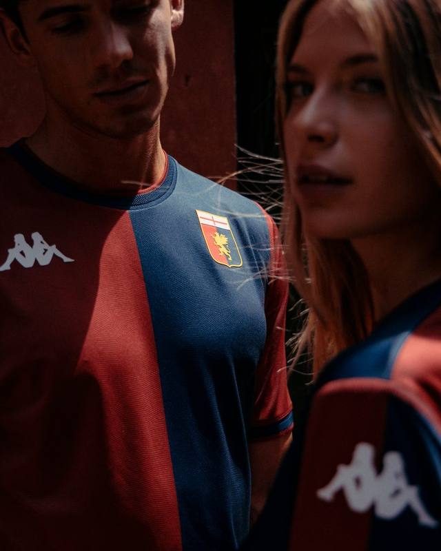 A campaign photo showcasing the Genoa CFC 2024/25 home shirt with its classic red and blue halves.