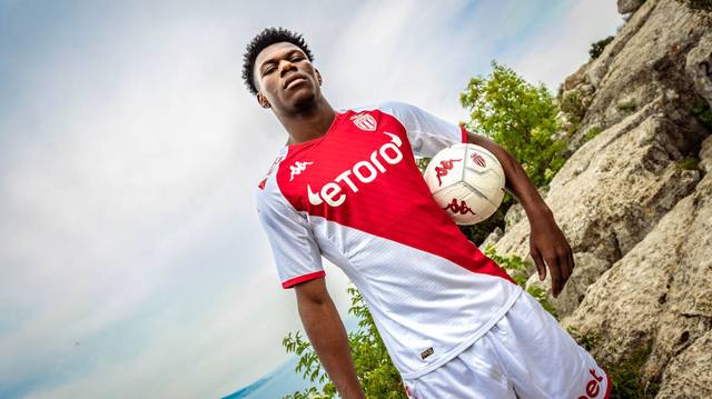 Aurélien Tchouaméni models the AS Monaco 2022/23 home shirt in an outdoor setting.