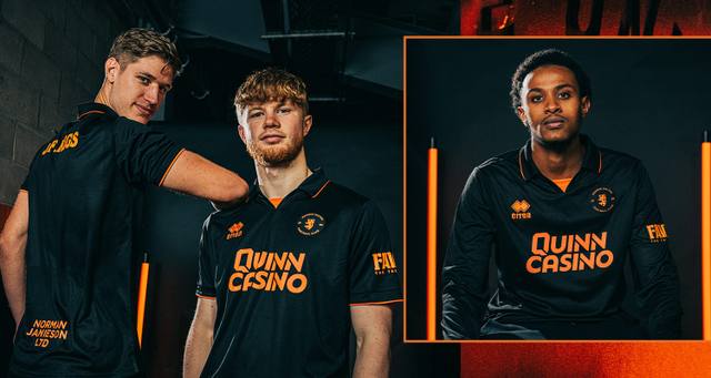 Dundee United players model the black and orange third shirt for the 2025/26 season.