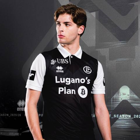 A model presents the FC Lugano 2025/26 home shirt in a studio photoshoot.