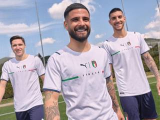 Italian players model the Italy 2021 away shirt in a promotional campaign shoot.