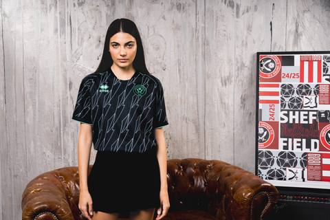 A model presenting the Sheffield United 2024/25 away shirt by Erreà
