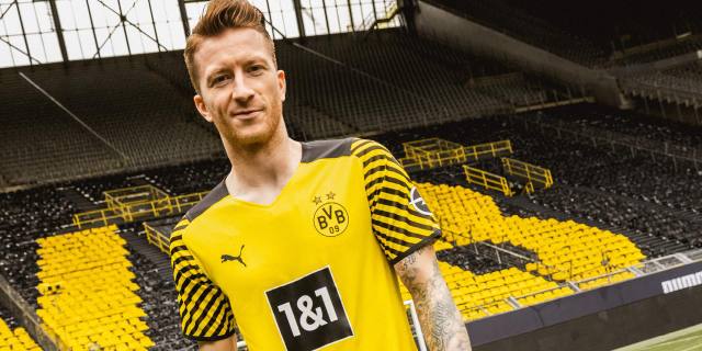 Marco Reus models the Borussia Dortmund 2021/22 home shirt at the Signal Iduna Park.