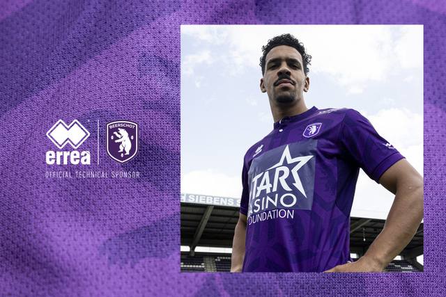 A promotional graphic for Beerschot's home shirt featuring a player wearing the purple kit against a stadium background next to Erreà and club logos.
