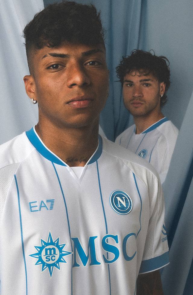 SSC Napoli player wearing the white away shirt with light blue pinstripes and MSC sponsor.