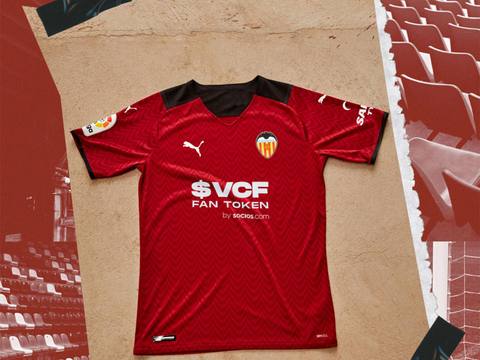 The Valencia CF 2021/22 away shirt by Puma shown in a flat lay campaign image.