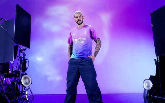 Theo Hernández posing in the AC Milan 2023/24 third shirt during a studio photoshoot.