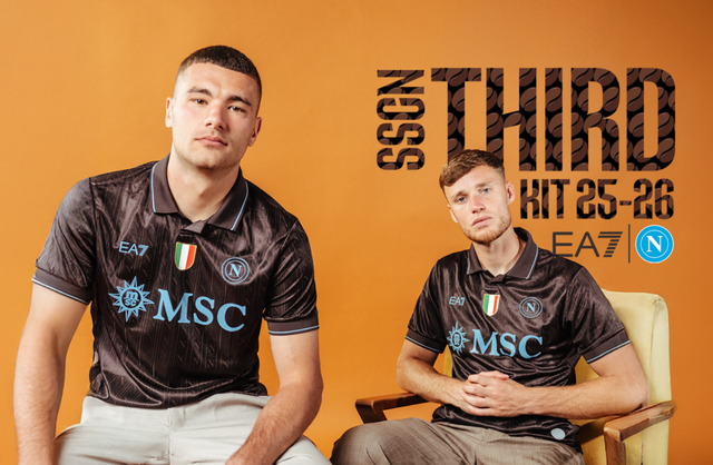 Two players modeling the dark brown SSC Napoli 2025/26 third kit with light blue details.