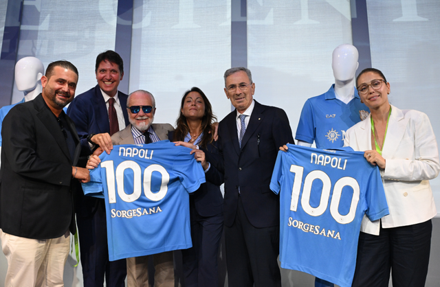SSC Napoli representatives present the club's centenary home shirt aboard a cruise ship.
