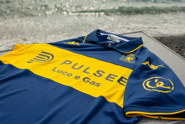 A close-up shot of the Genoa CFC special edition shirt featuring a blue and yellow design with the Pulsee sponsor and Ceres sleeve logo.