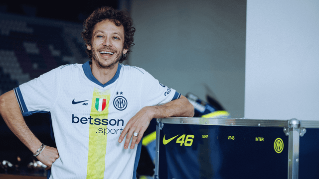 Valentino Rossi wears a special edition Inter Milan white away shirt with yellow details and VR46 branding.